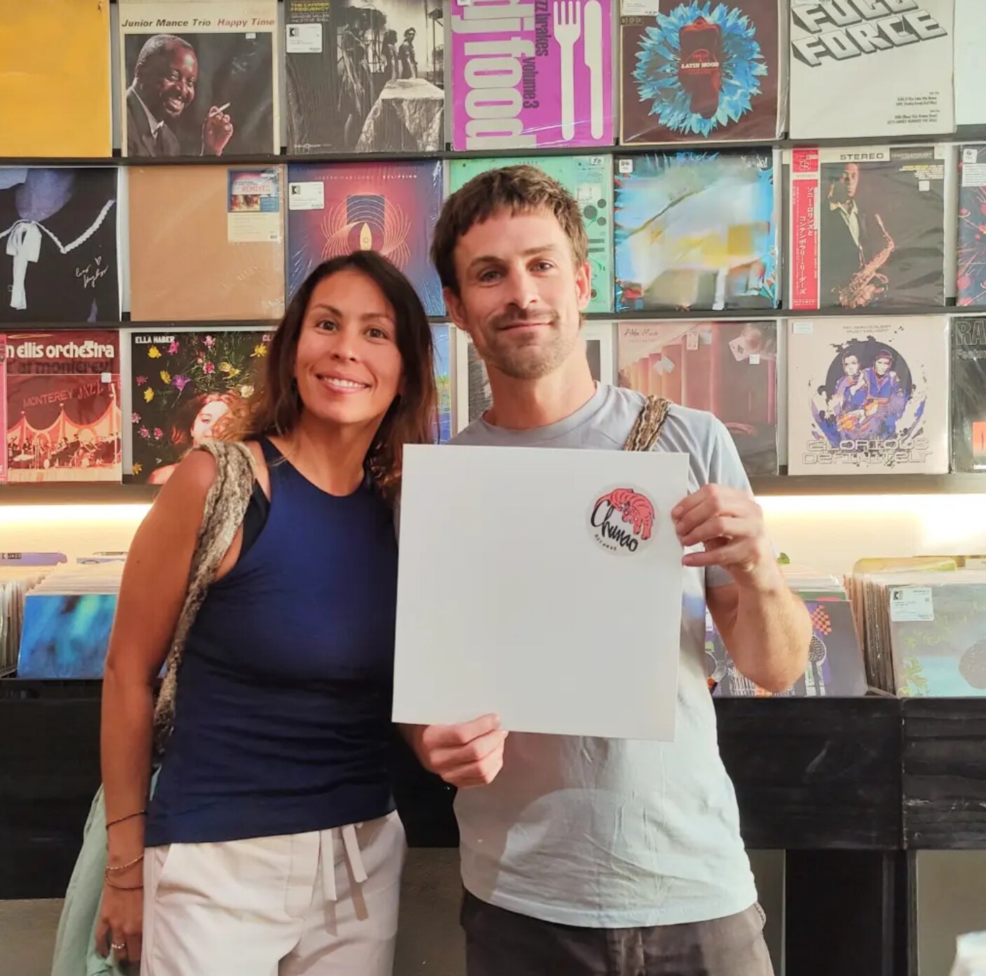 couple holding white record